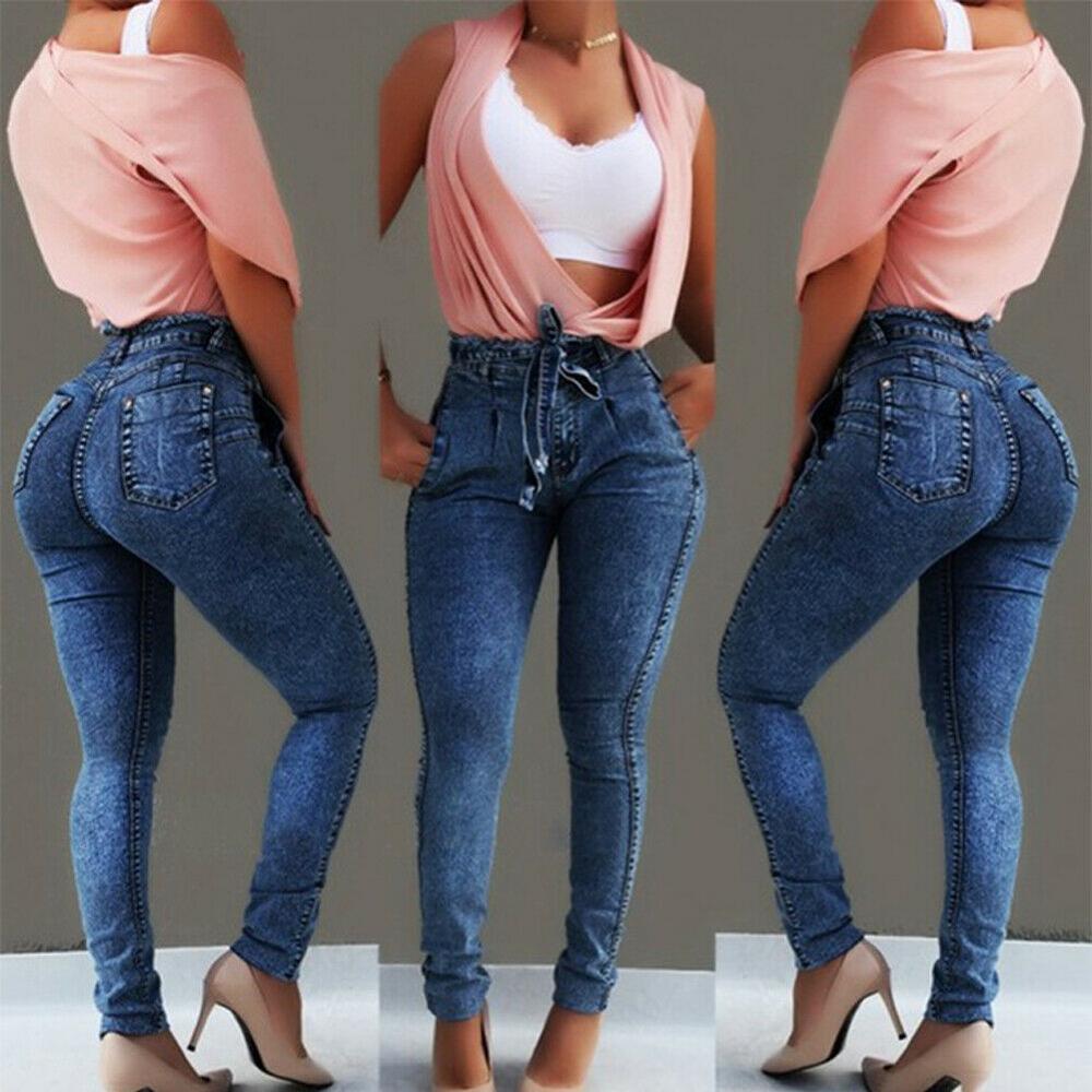 High waisted jeans with tassel belt